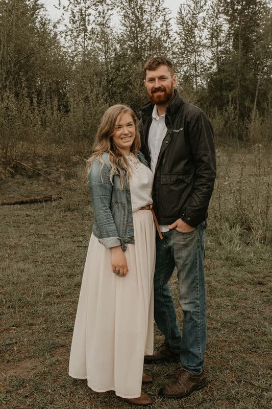 Kyle and Sarah Van Egdom standing in a field